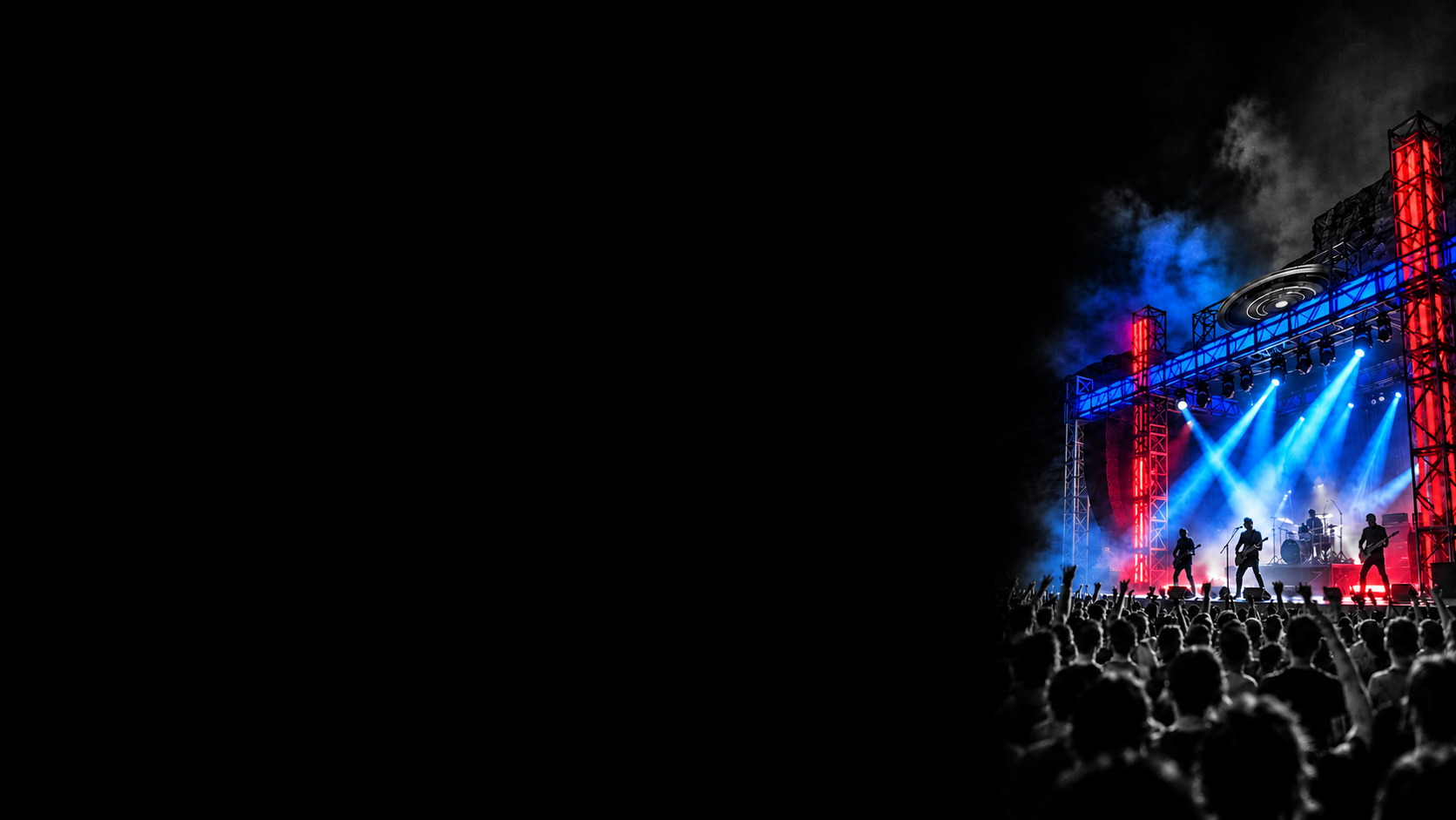 A live band and grayscale audience under blue spotlights and red stage lighting.